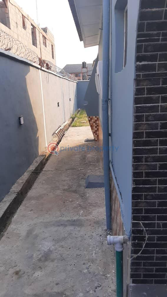 A 3 bedroom bungalow with 2 sitting room and 2 kitchen and a mini flat bq and an extra half plot of land. - 5 3 bedroom Detached Bungalow For Sale Iyana Ishashi Ojo Lagos - 5