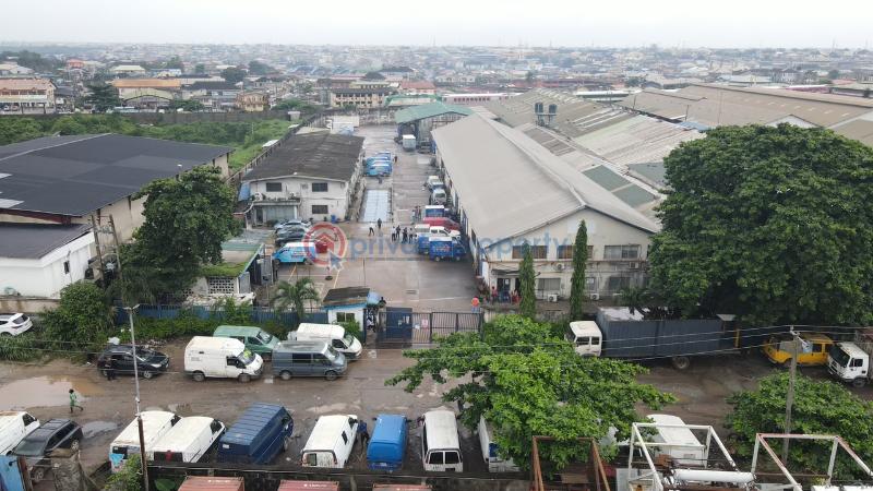 Factory For Sale Total Land Area: 16,570 Sqm * Existing Warehouse Space: 9,453.19 Sqm * Open/unused Space: 6,951.11 Sqm * Additional Administrative Block: 437sqm Ikeja  Lagos - 6