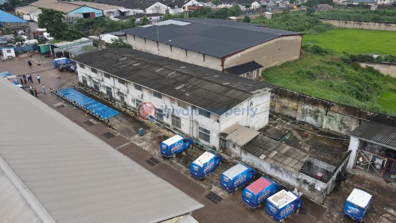 Factory For Sale Total Land Area: 16,570 Sqm * Existing Warehouse Space: 9,453.19 Sqm * Open/unused Space: 6,951.11 Sqm * Additional Administrative Block: 437sqm Ikeja  Lagos - 4