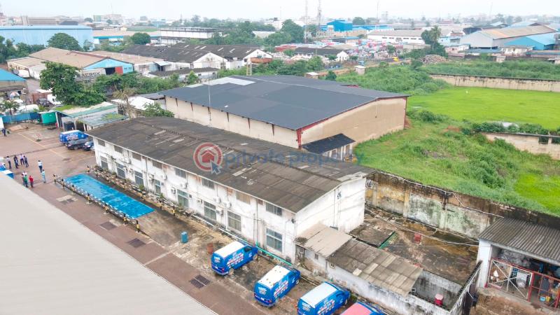 Factory For Sale Total Land Area: 16,570 Sqm * Existing Warehouse Space: 9,453.19 Sqm * Open/unused Space: 6,951.11 Sqm * Additional Administrative Block: 437sqm Ikeja  Lagos - 2