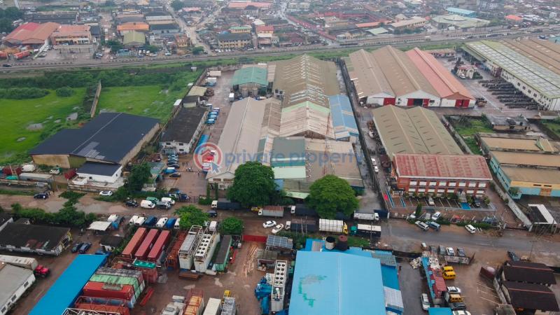 Factory For Sale Total Land Area: 16,570 Sqm * Existing Warehouse Space: 9,453.19 Sqm * Open/unused Space: 6,951.11 Sqm * Additional Administrative Block: 437sqm Ikeja  Lagos - 0