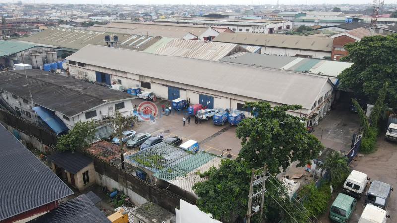 Factory For Sale Total Land Area: 16,570 Sqm * Existing Warehouse Space: 9,453.19 Sqm * Open/unused Space: 6,951.11 Sqm * Additional Administrative Block: 437sqm Ikeja  Lagos - 5